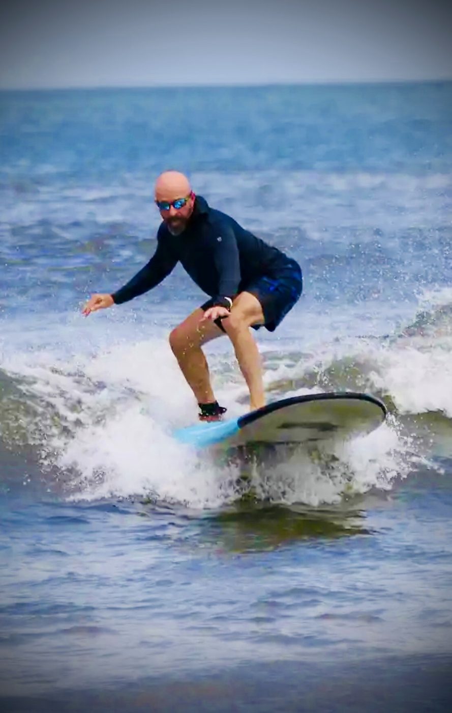 Russ surfing a wave